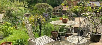 Peaceful separate annexe with bed, kitchen, shower room and patio area.