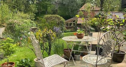 Peaceful separate annexe with bed, kitchen, shower room and patio area.