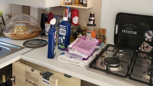 A kitchen with a stove, various food items, and storage containers. - La bretagne ça gagne vous!! near Vannes Sarzeau STgildas de ruys (Surzur)