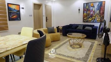 Apartament Deluxe, balcó, vistes a la ciutat | Sala d'estar