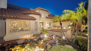 A residential property with a tiled roof, a swimming pool, and a landscaped garden with palm trees. - Scenic Luxury Oasis: Views, Pool, Spa, Game & Movie Rms (Bonita)