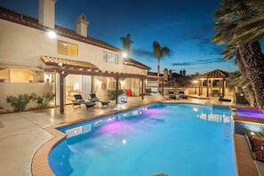 A swimming pool with lounge chairs and a covered patio area. - Scenic Luxury Oasis: Views, Pool, Spa, Game & Movie Rms (Bonita)