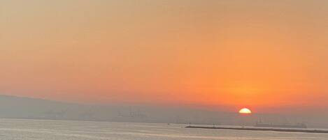 On the beach, sun loungers, beach towels