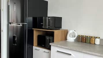 Basic Shared Dormitory, City View | Shared kitchen | Full-size fridge, microwave, oven, stovetop