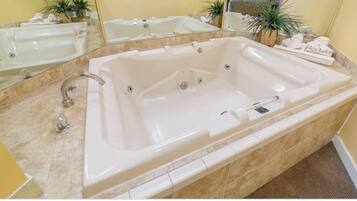 Jetted tub, hair dryer, towels, soap