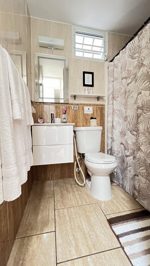 Shower, hair dryer, towels, soap