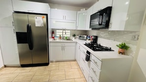Fridge, microwave, stovetop, coffee/tea maker