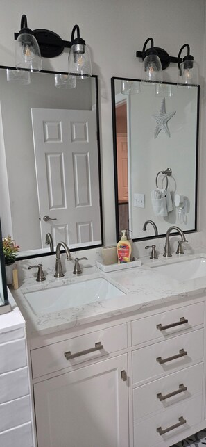 Shower, hair dryer, towels, toilet paper