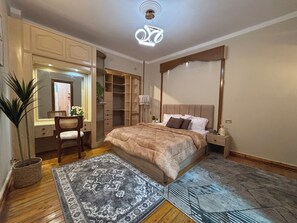 Family Apartment, Balcony, City View | 3 bedrooms, in-room safe, desk, laptop workspace