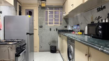 Family Apartment, Balcony, City View | Private kitchen | Full-sized fridge, microwave, oven, stovetop