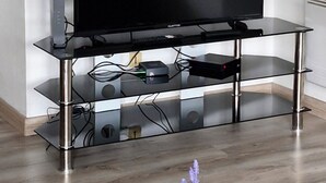 A modern entertainment center with a flat-screen TV, built-in speakers, and a sleek design. - Lovely studio 15min walk from Epinal town center (Chantraine)