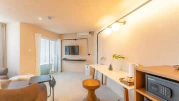 Suite, City View | Living area | TV