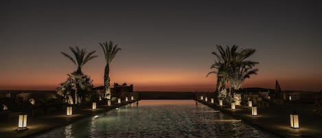 Indoor pool, outdoor pool, open 9:00 AM to 8:00 PM, pool umbrellas