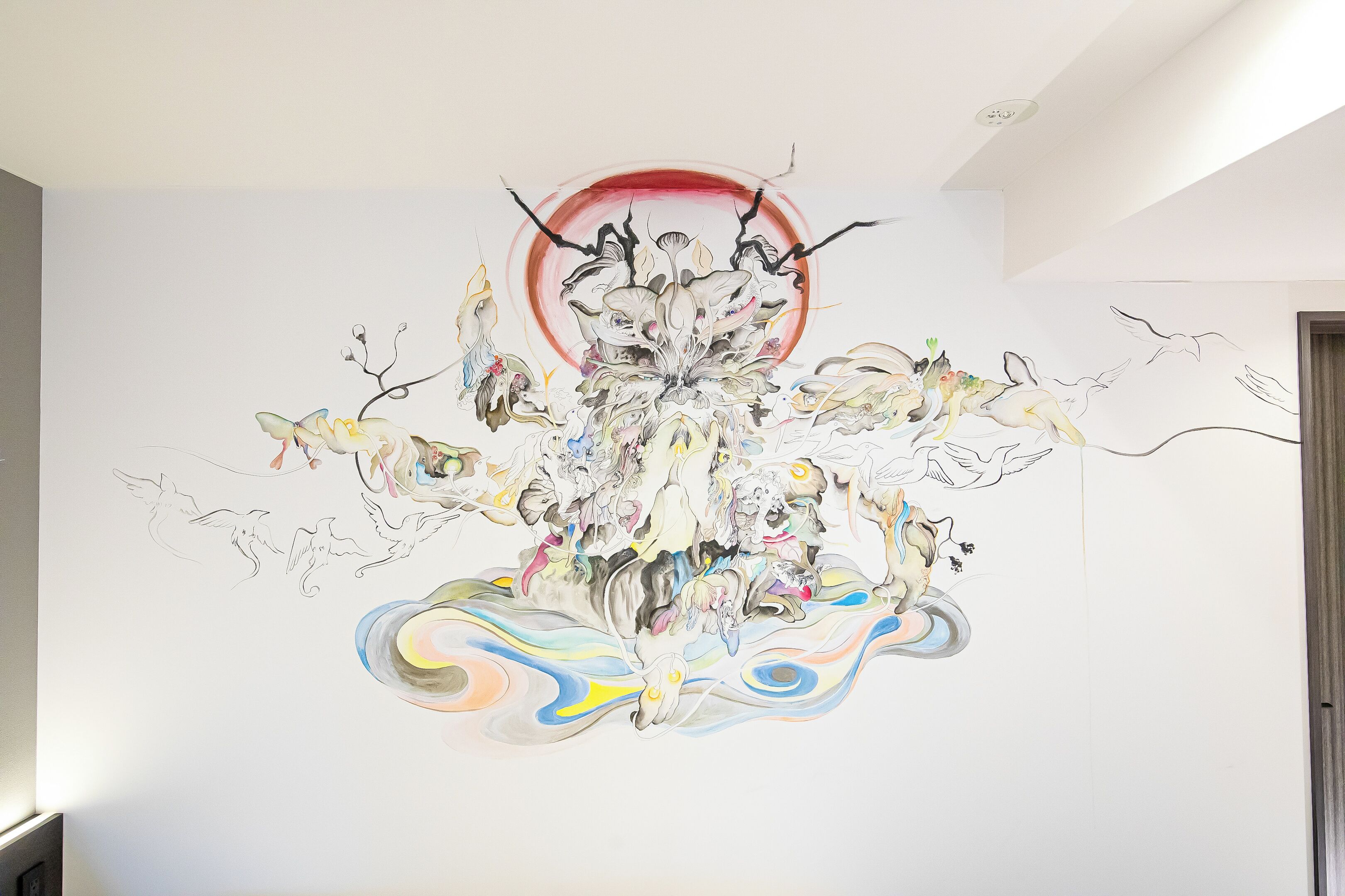 A wall mural with abstract and surreal artwork.