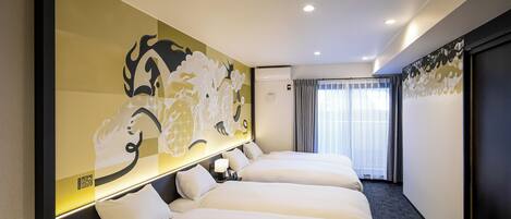 A hotel room with three beds, a large abstract mural on the wall, a modern air conditioning unit, and a view of the outdoors through a window with curtains.