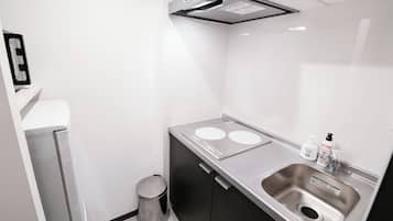 Mini-fridge, microwave, stovetop, cookware/dishes/utensils