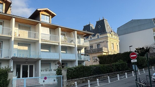 A multi-story building with balconies, a gated entrance, and a no-entry sign. - Bright T2 with garage and WiFi in Aix-les-Bains (Aix-les-Bains)