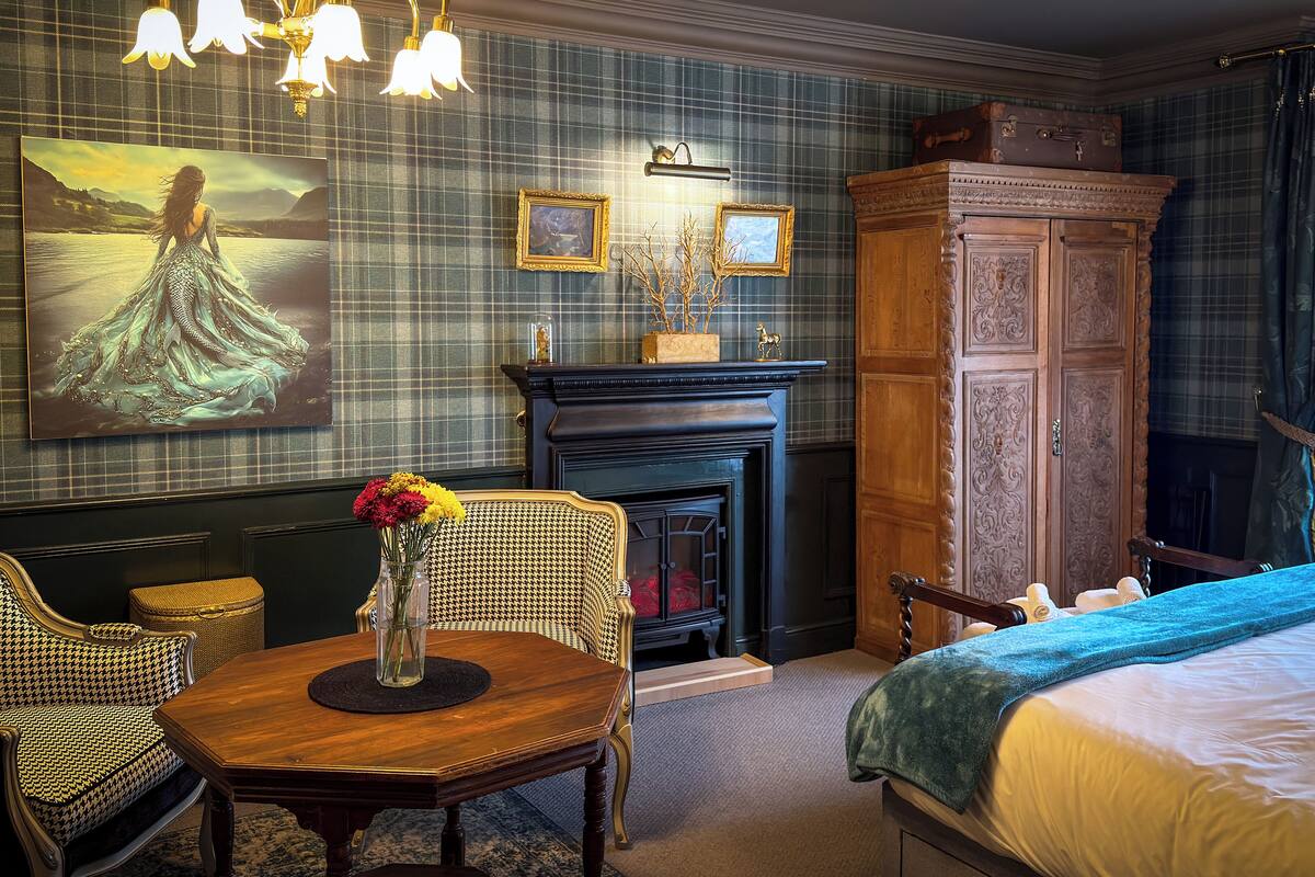 Desk, laptop workspace, blackout drapes, iron/ironing board