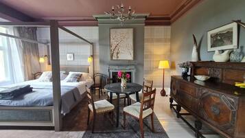 Desk, laptop workspace, blackout drapes, iron/ironing board