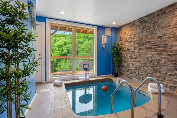 Relax in this cabin`s private pool, where the peaceful atmosphere of the Smoky Mountains enhances your perfect retreat.