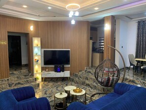 Standard Apartment, Balcony, City View | Living area | Flat-screen TV - Size99 Apartment and Suites (Owerri)