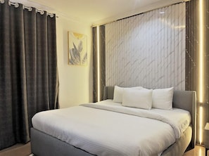 Standard Apartment, Balcony, City View | In-room safe, desk, laptop workspace, blackout drapes