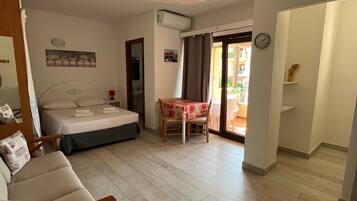 Classic Studio, 1 Double Bed, Balcony | Living area | Flat-screen TV