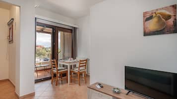 Classic Studio, 1 Double Bed with Sofa bed, Balcony | Living area | Flat-screen TV