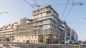 A modern hotel with multiple floors, large windows, and a prominent entrance. - Apartment in Nieuwpoort With Balcony (Nieuwpoort)