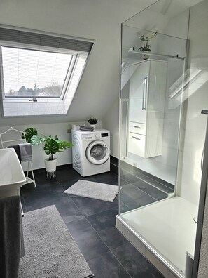 Shower, hair dryer, towels, soap
