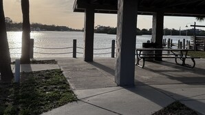 A waterfront park with a covered pavilion, benches, and a view of the water. - "The Salty Lime"  Walk to Restaurant/bars, park. (Port Richey)