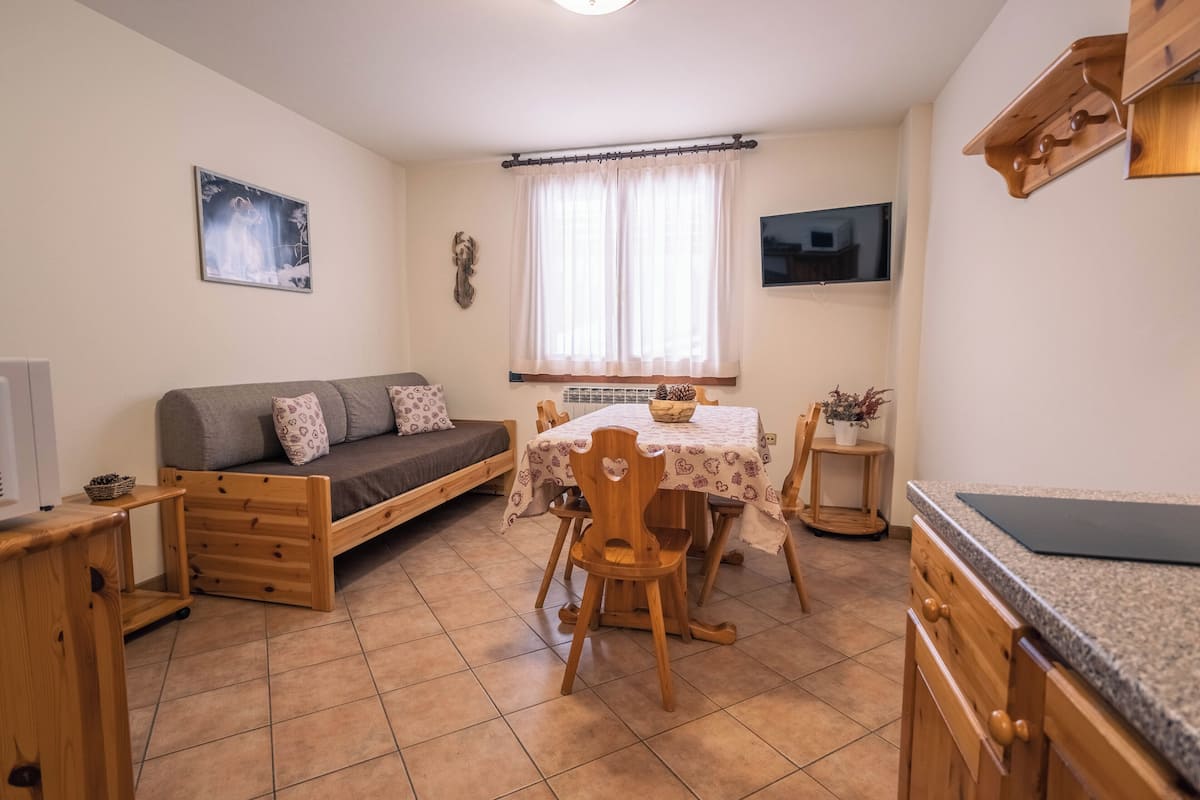 Standard Apartment | Living area | 32-inch Smart TV with satellite channels