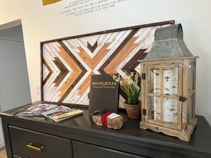 Welcome to our reception area, where a magazine, book, and potted plant create a warm atmosphere.