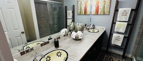 Shower, hair dryer, towels, soap