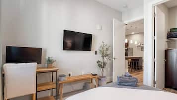 1 bedroom, desk, iron/ironing board, travel crib