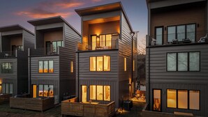 A modern multi-story residential building with balconies, large windows, and outdoor seating areas. - Amazing Panoramic Views From This Luxury Retreat, Enjoy The Sauna On Top Deck. (Chattanooga)