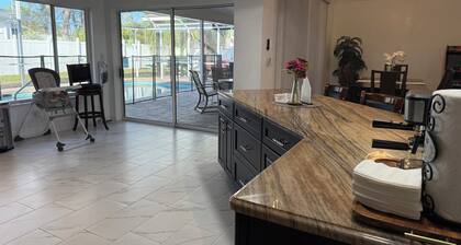 The Perfect Gateway Home with a large pool area, Gazebo, all fenced in.