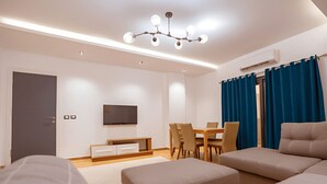 TV - Comfortable 1BR Apartment near Cairo Airport with 2 Balconies (South Acadmey , New Cairo)