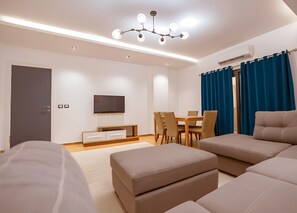 TV - Comfortable 1BR Apartment near Cairo Airport with 2 Balconies (South Acadmey , New Cairo)