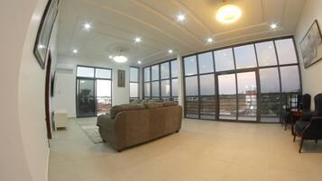 Luxury Penthouse, Ocean View | Living area | 65-inch Smart TV with digital channels