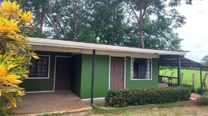 Guests can enjoy a peaceful stay in this charming single-story building with a porch and garden.