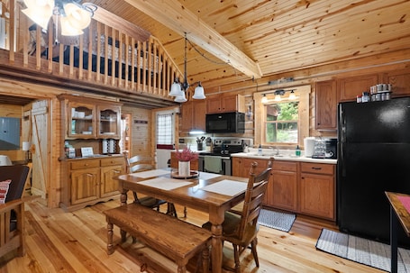 Fridge, microwave, oven, stovetop. Charming cabin that has beds for 8 guests, hot tub, electric fireplace, firepit