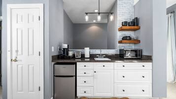 Microwave, coffee/tea maker, toaster, cookware/dishes/utensils