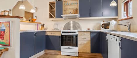 Fridge, stovetop, dishwasher, coffee/tea maker