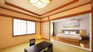 A traditional Japanese-style room with tatami flooring, a low table, and a sliding door leading to a bedroom with a bed and bedside tables. - Ito Villa-TOKI- (Ito)