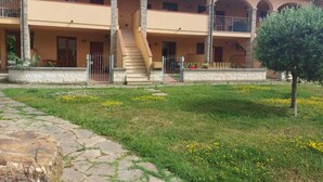 A two-story building with a stone staircase leading to an upper balcony. - Located in a quiet and pleasant setting a stone's throw from the sea (Toscana)