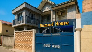 A two-story building with a sign reading "Diamond House".