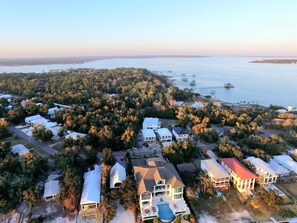 An aerial view of a coastal residential area with houses, a large body of water, and docks. - Bear Point Bay Front Beach House! Sleeps 12 (Orange Beach)