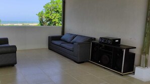 Family Quadruple Room, 1 Bedroom | Living area