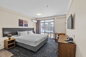 Pillow-top beds, laptop workspace, blackout curtains, iron/ironing board